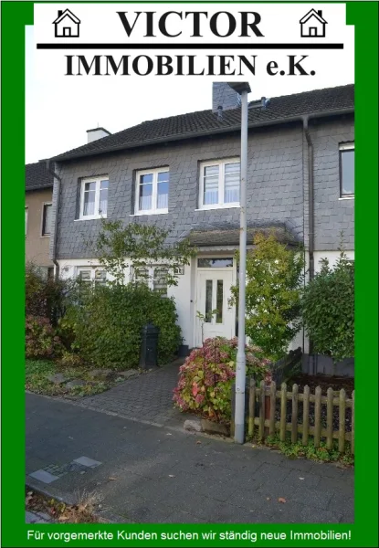 Vorderfront und neuer Eingang - Haus kaufen in Duisburg - Großes, gepflegtes Reihenhaus in ruhiger, schöner Lage mit Wintergarten, Dachstudio und Garage