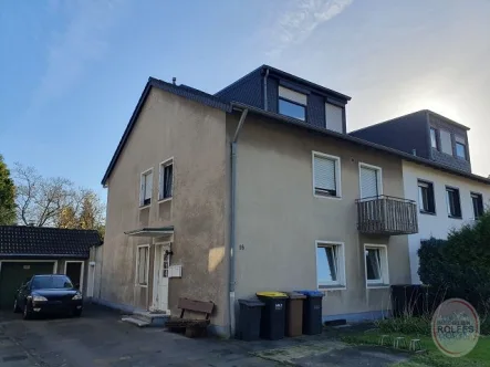 Straßenansicht - Wohnung kaufen in Bergheim - bezugsfreie 3-Zimmer Erdgeschosswohnung mit Terrasse und Garten in Oberaußem