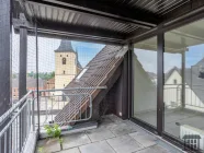 Loggia mit Blick auf den Kirchturm