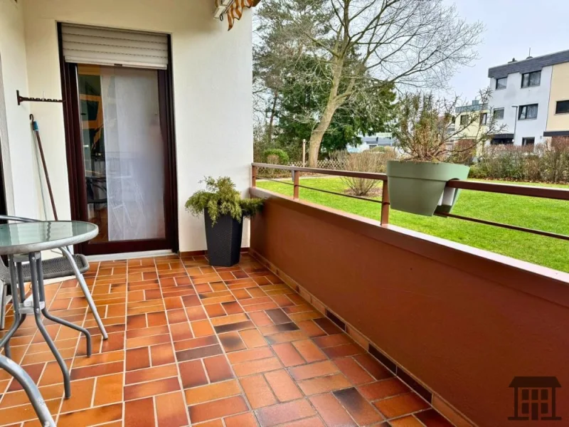 Balkon mit Blick in die grüne Gemeinschaftsanlage