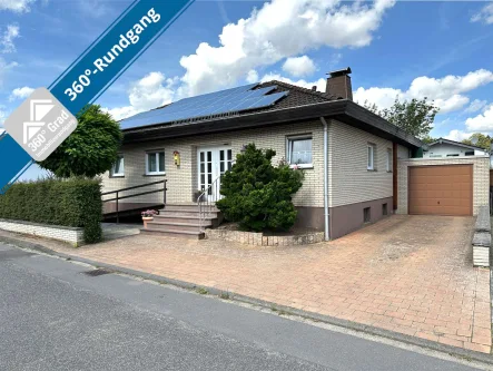 Ansicht - Haus kaufen in Mechernich - Bungalow mit Wintergarten und traumhaftem Garten in zentraler Lage von Kommern wartet auf Sie!