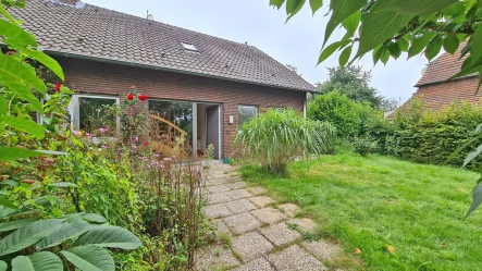 Frontalansicht - Haus kaufen in Voerde / Löhnen - Ihr Traumhaus wartet: Charmantes Einfamilienhaus mit Anbau und Garage im malerischen Löhnen!