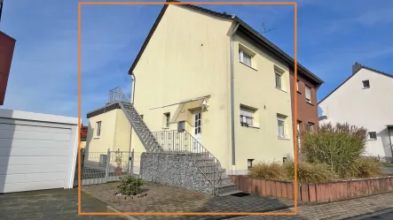 Außenansicht - Haus kaufen in Moers - Charmante Doppelhaushälfte mit Wärmedämmung in der Vogelsiedlung Moers-Hülsdonk!