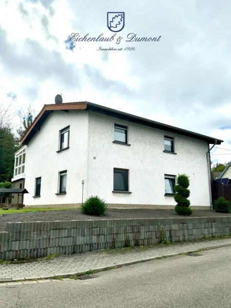 Freistehendes EFH - Haus kaufen in Saarbrücken / Ensheim - Freistehendes gepflegtes Einfamilienhaus mit Wintergarten + Garage