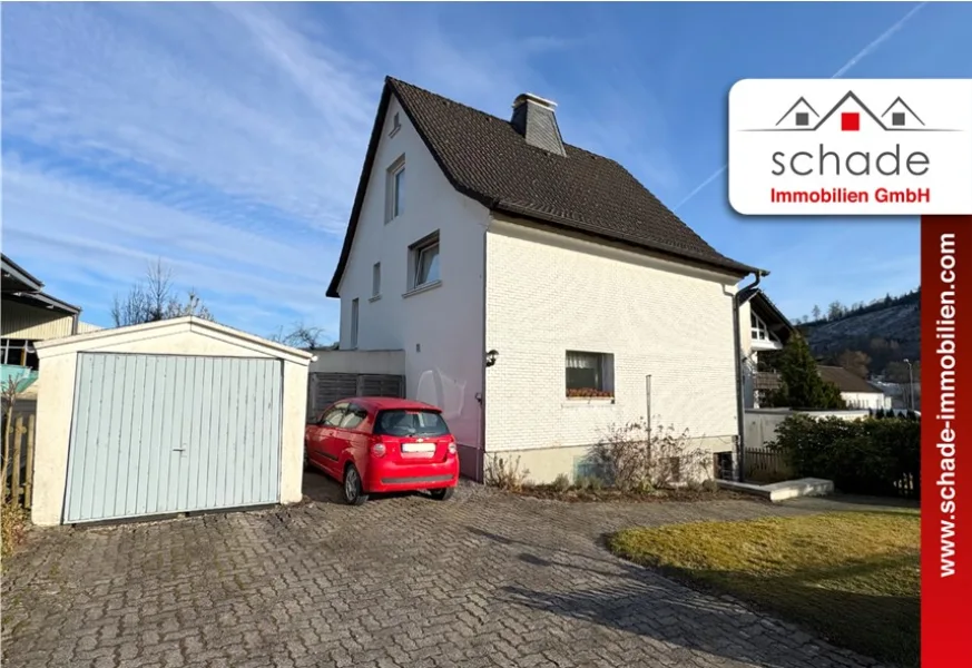 Titelbild - Haus kaufen in Herscheid / Hüinghausen - SCHADE IMMOBILIEN - Familienfreundliches Einfamilienhaus im schönen Hüinghausen!