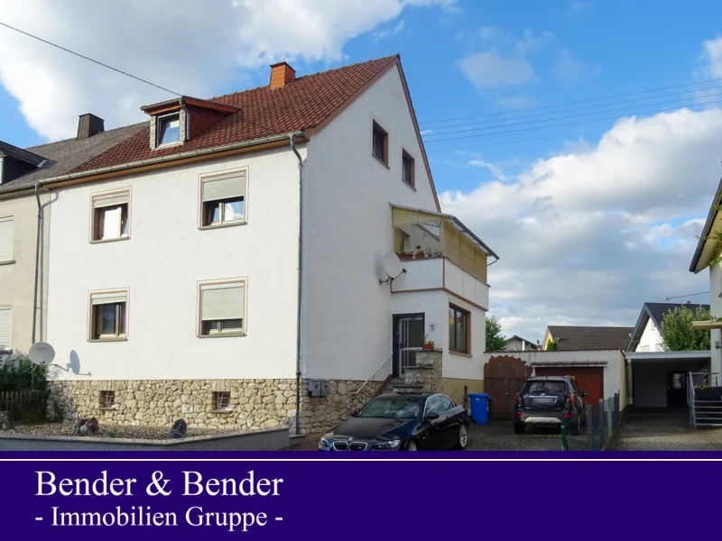 Seitenansicht - Haus kaufen in Hadamar - Vermietetes Zweifamilienhaus mit Garten in Niederhadamar!