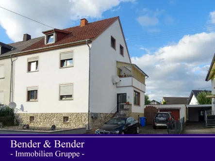 Seitenansicht - Haus kaufen in Limburg an der Lahn - Vermietetes Zweifamilienhaus mit Garten in Niederhadamar!