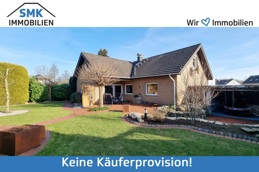 Titelbild - Haus kaufen in Schloß Holte-Stukenbrock - Großzügiges Ein-/Zweifamilienhaus für Gartenliebhaber!