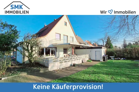 Titelbild - Haus kaufen in Verl - Einfamilienhaus mit Ladengeschäftin zentraler Lage von Verl - Bornholte