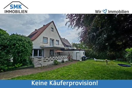 Titelbild - Haus kaufen in Verl - Einfamilienhaus mit Ladengeschäft in zentraler Lage von Verl - Bornholte