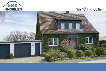 Titelbild - Haus mieten in Gütersloh - Romantisches Einfamilienhaus zur Miete – Ihr neues Zuhause im Grünen!