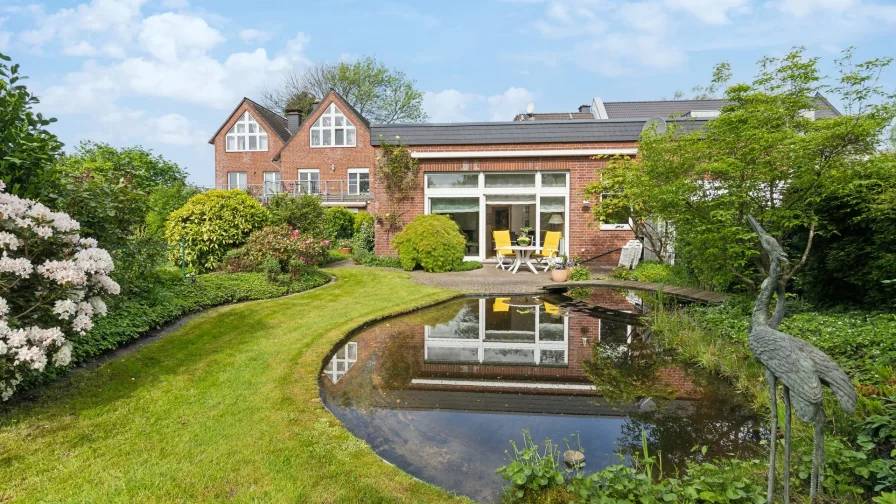 Rückansicht - Haus kaufen in Düsseldorf / Kaiserswerth - Bungalow als naturgebundene Ruheoase und einzigartigem Atrium in direkter Nähe von Kaiserswerth