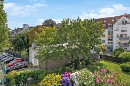 Ausblick - Wohnung kaufen in Düsseldorf - Familienfreundliche und vermietete 4-Zimmer-Wohnung am Belsenplatz