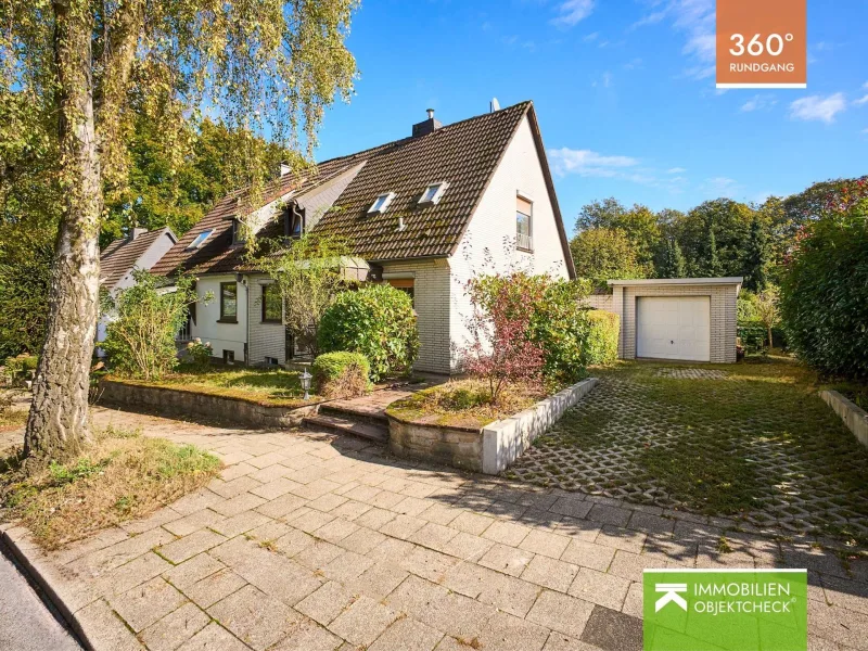 Blick auf das Haus - Haus kaufen in Heiligenhaus - Doppelhaushälfte in beliebter Wohnlage am Waldrand