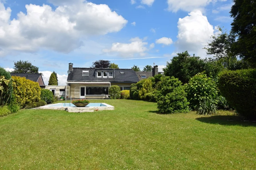 Titelbild - Haus kaufen in Nettetal - Attraktives Einfamilienhaus in ruhiger Lage mit Traumgarten und Seenähe in 41334 Nettetal