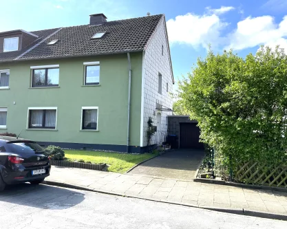 Hausansicht - Haus kaufen in Hattingen - Willkommen im Südstadt-Garten! Teilvermietetes Dreifamilienhaus in begehrter Lage