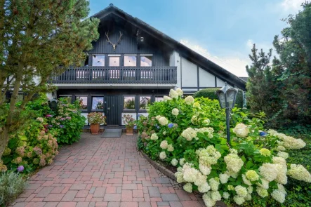 Hausansicht - Haus kaufen in Unna - Freistehendes Einfamilienhaus ca.164 m² mit Einliegerwohnung ca.37 m², mit Garten in Unna-Kessebüren