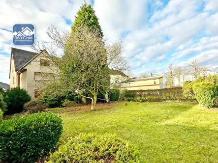 Titelbild - Haus kaufen in Bochum - Familienglück mit großem Gartenin Linden / Dahlhausen