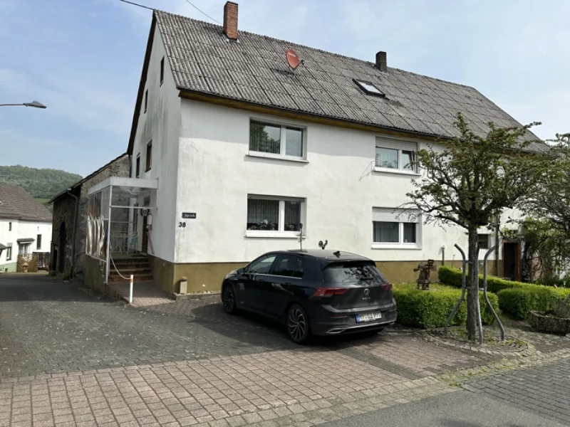 Oberstadtfeld - Haus kaufen in Oberstadtfeld - Oberstadtfeld: Einfamilienwohnhaus mit PKW-Garage und gemütlichen Gartengrundstück