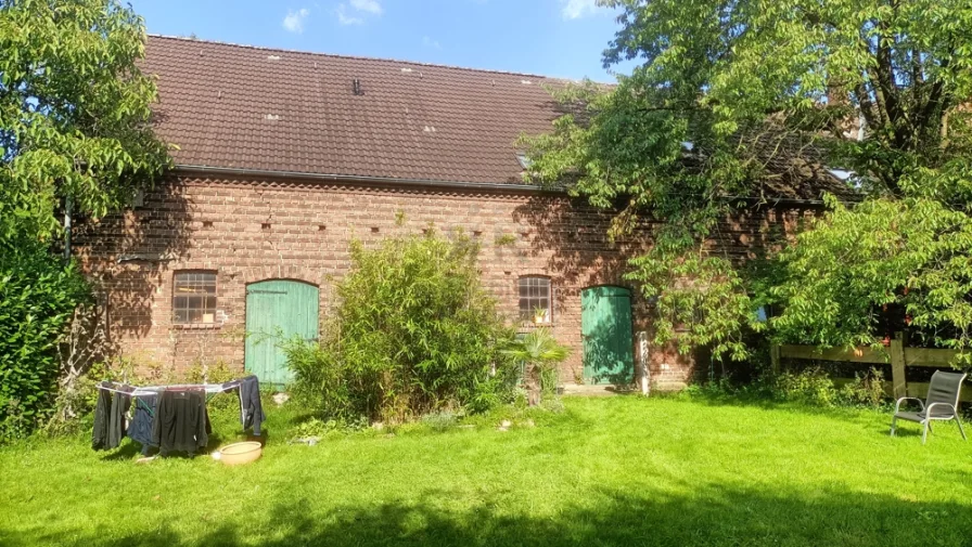 Rückansicht - Grundstück kaufen in Voerde - Gewerbegrundstück mit historischem Bauernhaus, Nebengebäuden und Halle!