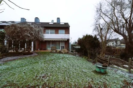 Gartenansicht - Haus kaufen in Dinslaken - Großzügiges Reihenendhaus mit Potenzial im Hagenbezirk! Sanierungsbedürftig!