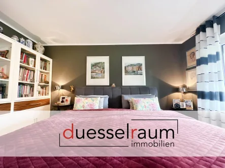 Titelbild - Wohnung kaufen in Düsseldorf - Urdenbach: Modern, begehrt und in Rheinnähe – Eigentumswohnung in beliebter und grüner Lage mit TG!