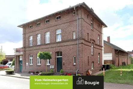 Straßenansicht - Haus kaufen in Gangelt - Anlageobjekt mit Gewerbefläche und 2 vermieteten Wohneinheiten!