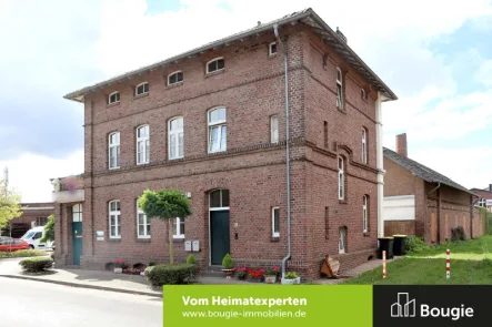 Straßenansicht - Haus kaufen in Gangelt - Anlageobjekt mit Gewerbefläche und 2 vermieteten Wohneinheiten!