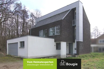 Straßenansicht - Haus kaufen in Selfkant - Energiesparendes Einfamilienhaus mit modernem Grundriss und Ausbaupotenzial!