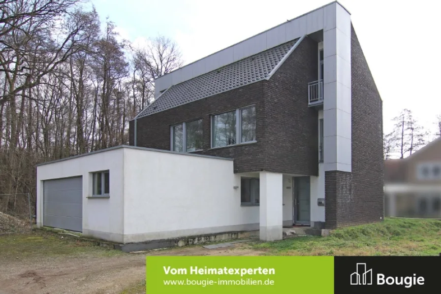 Straßenansicht - Haus kaufen in Selfkant - Energiesparendes Einfamilienhaus mit modernem Grundriss und Ausbaupotenzial!