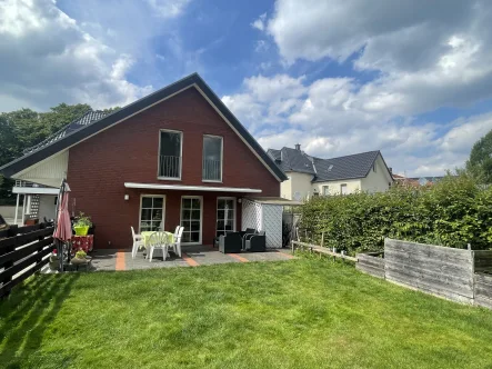 Titelbild - Haus kaufen in Herzebrock-Clarholz - Großzügiges Zweifamilienhaus in Herzebrock