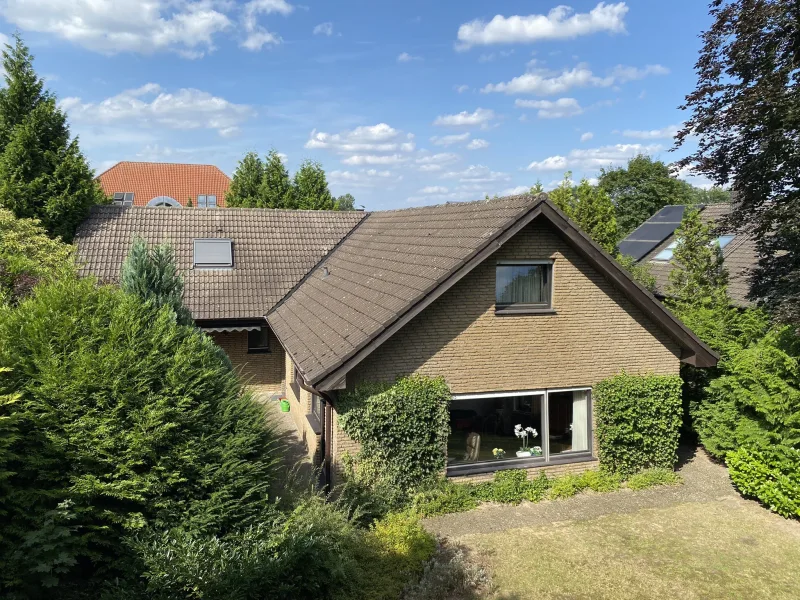 Titelbild - Haus kaufen in Gütersloh - Einfamilienbungalow mit separatem Baugrundstück in GT-Friedrichsdorf