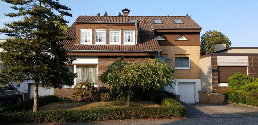 Frontansicht - Haus kaufen in Hamm - Aufgestockter Bungalow in idyllischer Sackgassenlage