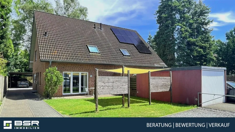 Westansicht - Haus kaufen in Rheda-Wiedenbrück - Familiengerecht und energetisch top modern!