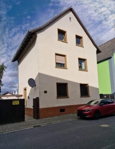 Expose - Haus kaufen in Rüsselsheim - Zweifamilienhaus mit schönem Garten und toller Terrasse