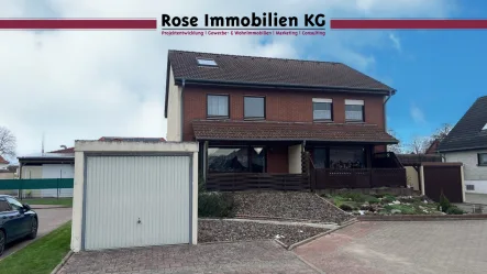 Außenansicht - Haus kaufen in Minden - Bezahlbare Doppelhaushälfte in solider Bauweise (Sackgassenlage)