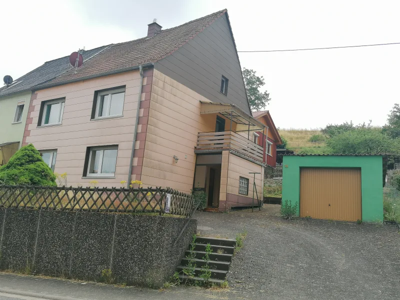  - Haus kaufen in Herchweiler - **Gemütliches EFH mit Garten & Garage in ruhiger Lage**