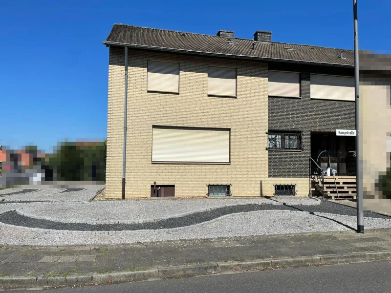 Vorderansicht - Haus kaufen in Jülich / Koslar - Einseitig angebautes Ein-/ Zweifamilienhaus in ruhiger Lage von Jülich-Koslar