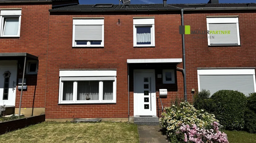 Vorderansicht - Haus kaufen in Eschweiler - Gemütliches Reihenmittelhaus mit Garage in ruhiger Wohnlage von Eschweiler