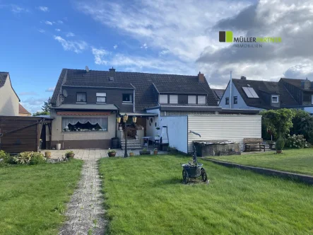 Gartenansicht - Haus kaufen in Langerwehe - Gepflegtes Einfamilienhaus mit Garage in guter Lage von Langerwehe