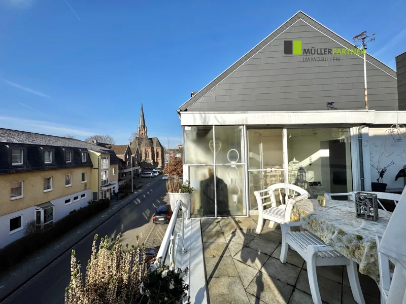 Titelbild - Haus kaufen in Eschweiler - Wohn- & Geschäftshaus mit Dachterrasse im Herzen von Eschweiler