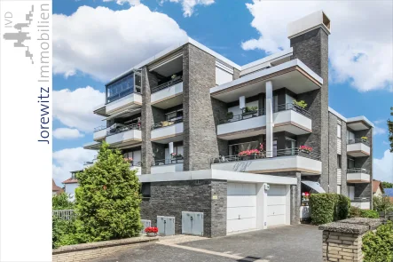 001 - Seitenansicht - Wohnung kaufen in Bielefeld - Sanierte und sonnige 2 Zimmer-Wohnung mit 2 Balkonen in ruhiger Lage von Bi-Hillegossen