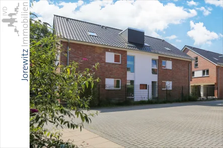 001 - Eingangsansicht - Wohnung kaufen in Bielefeld - Bi-Stieghorst - Erstbezug: Familienfreundliche 4 Zimmer-Wohnung inkl. Garage, Terrasse und Garten