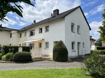 Rückansicht - Haus kaufen in Sankt Augustin - Ein- bis Zweifamilienhaus mit Traumgarten in St. Augustin-Buisdorf