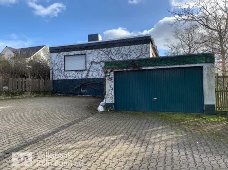 Ansicht - Haus kaufen in Königswinter - Königswinter-Berghausen: Freistehender Bungalow mit schönem Grundstück in beliebter Lage!