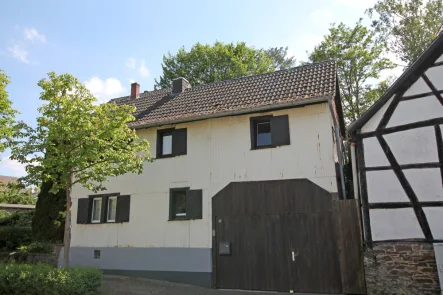 Straßenansicht - Haus kaufen in Euskirchen / Flamersheim - Gemütlicher Altbau mit großzügiger Erweiterung im Rohbau