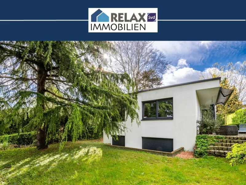 Ansichtsbild - Haus kaufen in Geilenkirchen - Modernisierter Bungalow mit Einliegerwohnung in Geilenkirchen