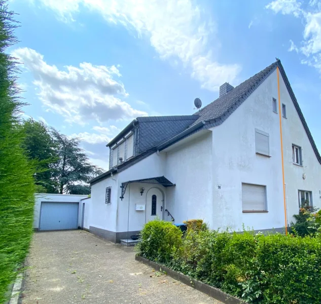 Titelbild - Haus kaufen in Duisburg - Ruhig und doch zentral - Doppelhaushälfte in Homberg