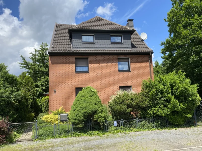 Vorderansicht - Haus kaufen in Duisburg / Serm - Zweifamilienhaus mit parkähnlichem Grundstück in DU-Serm