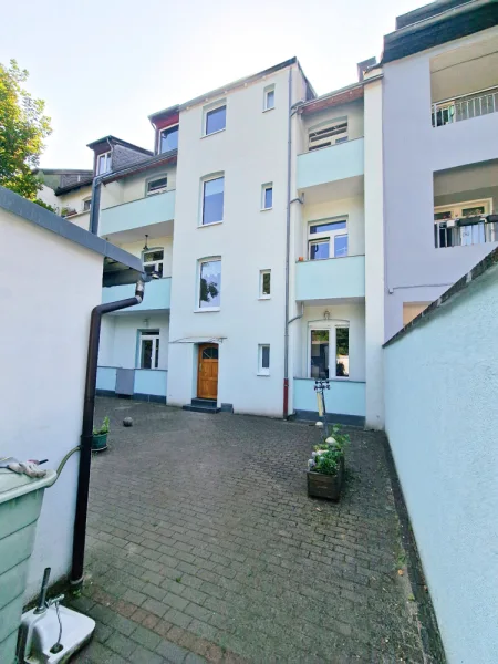 Rückansicht - Haus kaufen in Bochum - MEHRFAMILIENHAUS VON EIGENTÜMERN LIEBEVOLL SANIERT UND GEPFLEGT